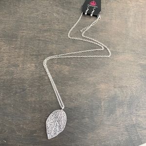 Metallic gem feather necklace and matching earrings. Never before worn.